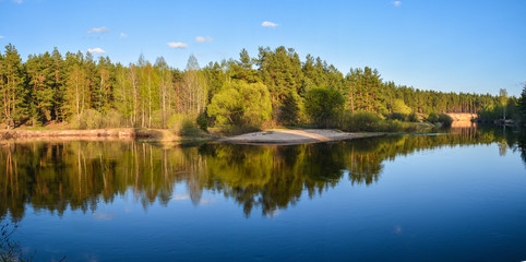 Fototapeta na wymiar Panorama of the spring forest river.