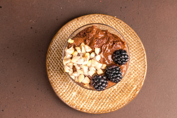 Dark chocolate mousse with blackberries and roasted hazelnuts