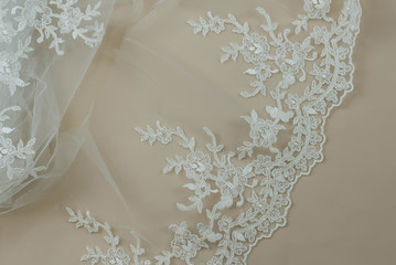 Texture lace fabric. lace on white background studio. thin fabric made of yarn or thread. a...