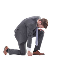 in full growth. focused businessman standing at the start.