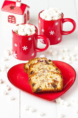 Fototapeta na wymiar Mugs filled with hot chocolate and Christmas cake