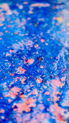 Abstract pink and blue painting on canvas using liquid acrylic technique. Marble slice texture