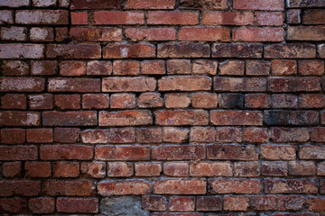 Texture of old brickwork with peeling color paint