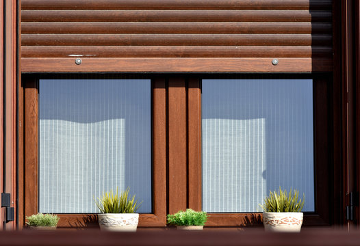 Wooden Window With Blind Decorated With Flower Pots