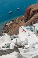Greece, Santorini island, white houses and sea with yachts.  Luxury background.