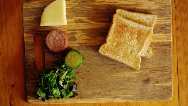 Making Of Small Tasty Sandwiches On The Old Wooden Table. Top Down View.