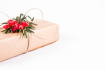 Gift decorated with a gunny string bow and with a common yew twig 