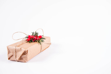 Gift decorated with a gunny string bow and with a common yew twig 