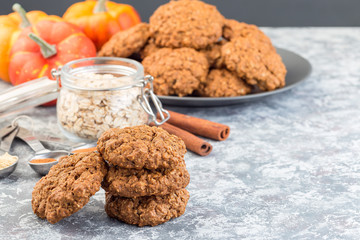 Spicy pumpkin and oatmeal cookies on the table and on  cooling rack, horizontal, copy space