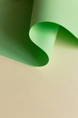 Neo mint color paper curve seamless line on pale yellowish plane white abstract geometric background