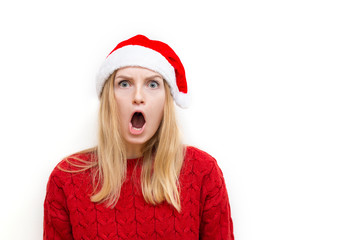 Puzzled confused bewildered shocked amazed woman in santa claus hat . Comical reaction, emotion facial expression and feelings concept.