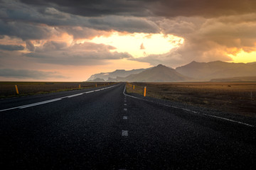 Naklejka premium Typical icelandic landscape with empty road and scenic nature.