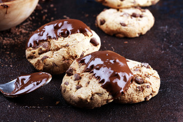 Chocolate cookies on wooden table. Chocolate chip cookies shot on table