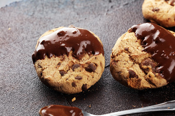Chocolate cookies on wooden table. Chocolate chip cookies shot on table