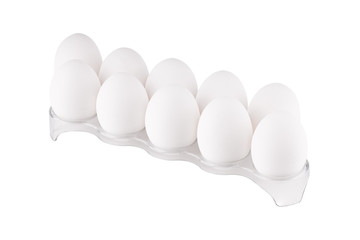 isolated on white stack of chicken eggs at plastic holder.