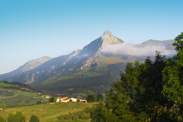 Fototapeta premium landscape of farms and mountains in Euskadi