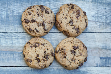 Four cookies on a wooden board