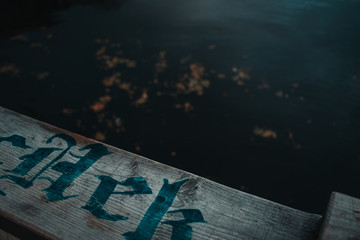 old dry board on the background of the river