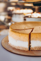 Piece of pumpkin homemade cake. Festive dessert concept. pumpkin tart on cozy cafe background, selective focus, noise effect