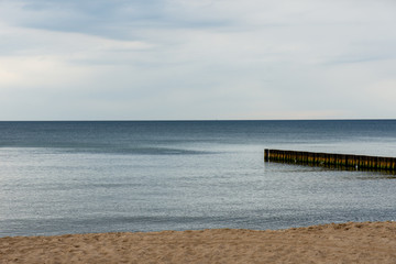 Breakwaters at sea during a calm day