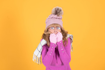 woman with cold expression wearing warm clothes