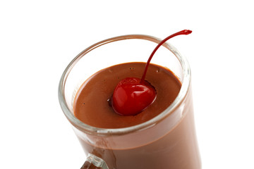 Mug with liquid chocolate decorated with a cherry
