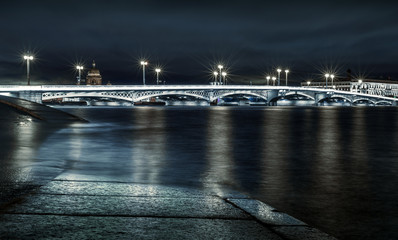 Crossing the Neva river in St. Petersburg at night, the city center, flooding