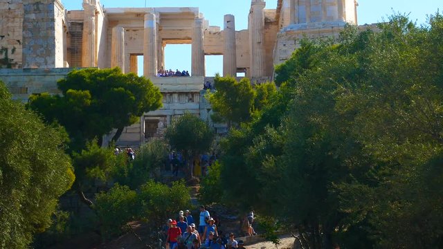 Entrance To The Athenian Acropolis With Tourists.