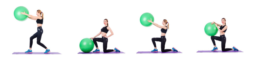 Young woman with ball exercising on white