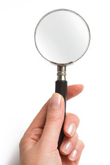 Hand holding magnifying glass on white background.