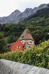 The oldest house in the Principality of Liechtenstein is the Red House, medieval European architecture and a vineyard. The main attraction of Liechtenstein, Vaduz.