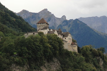 Fototapeta na wymiar Vaduz Castle, Liechtenstein - the official residence of the prince. Medieval european castle against the backdrop of the Alps mountains.