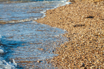 sea pebbles colored granite on the beach