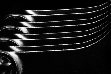 high performance racing motorcycle engine parts on a black reflective background