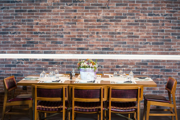 Lunch table with brick wall background 