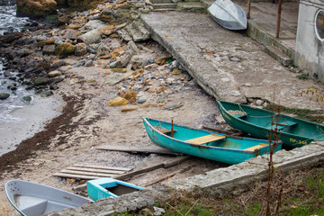 Boats on a rocky shore - sea pier, boat station