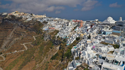Aerial drone photo of Fira main village of Santorini island with breathtaking views to Caldera and Aegean sea, Cyclades, Greece