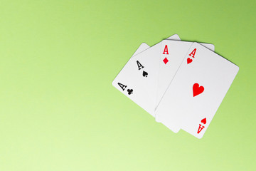 Four aces on green background. Concept of gambling risk