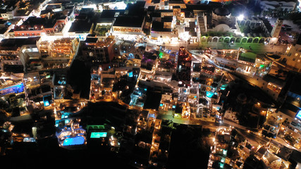 Fototapeta na wymiar Aerial night shot of iconic village of Fira built on top of cliff, Santorini island, Cyclades, Greece