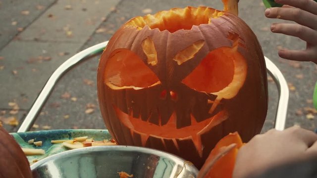 Halloween pumpkin, which carves a boy outside
