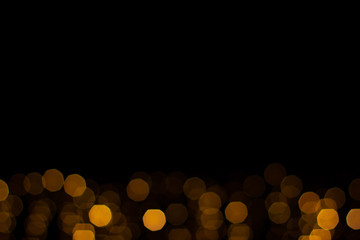 simple wallpaper background pattern  black copy space for your text with unfocused golden bokeh, Christmas and winter holidays picture style 