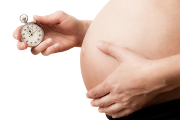 pregnant woman holding cronograph