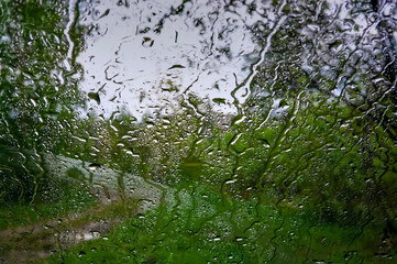 Background of natural water condensation. Raindrops on the glass.