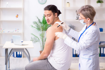 Young patient visiting doctor in hospital