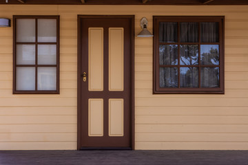 Historic cabin entrance door and two windows
