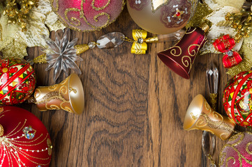 Christmas decoration ornament, new year toys of red and gold colors on wooden background, winter holidays and celebrations concept, selective focus 