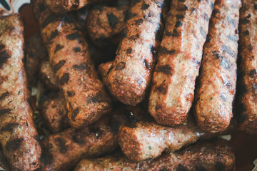 Tasty grilled hot sausages extreme closeup