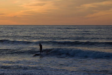 Surfer on the Beach at Sunset