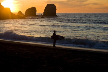 Surfer on the Beach at Sunset