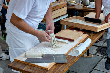Soba making, cutting the dough to noodle
